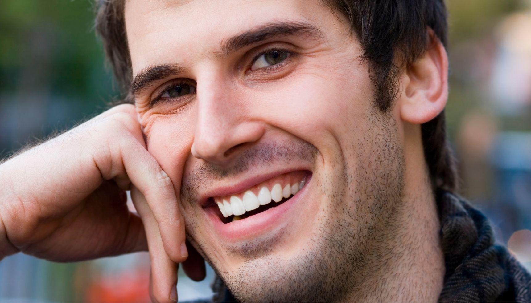 A person using a home whitening kit to brighten their smile.