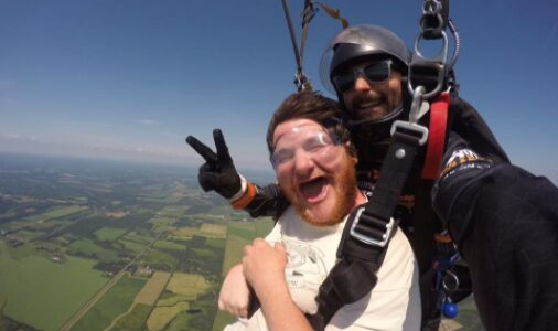 A man and a woman are flying through the air.