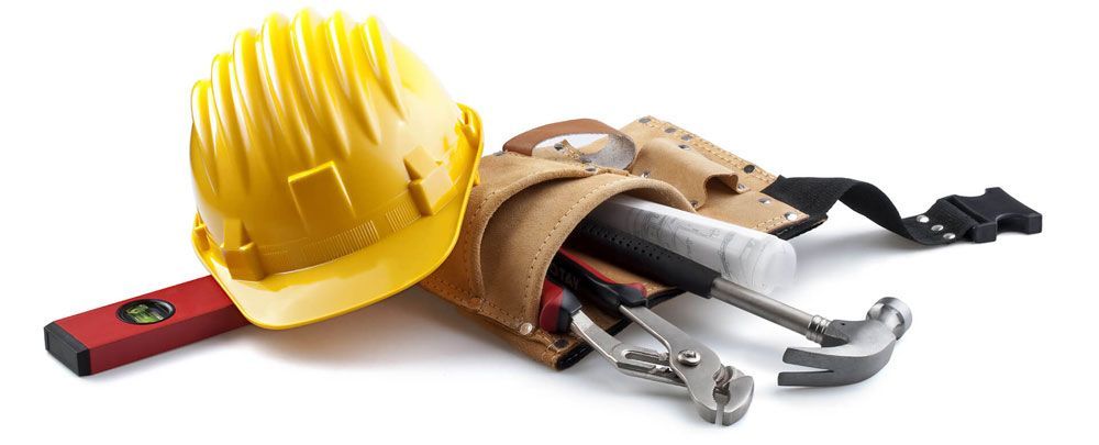 a hard hat is sitting on top of a tool belt filled with tools