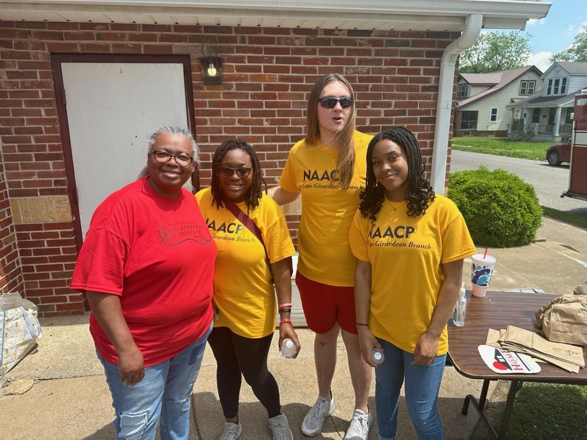 SEMO Students pose with community member while canvassing.