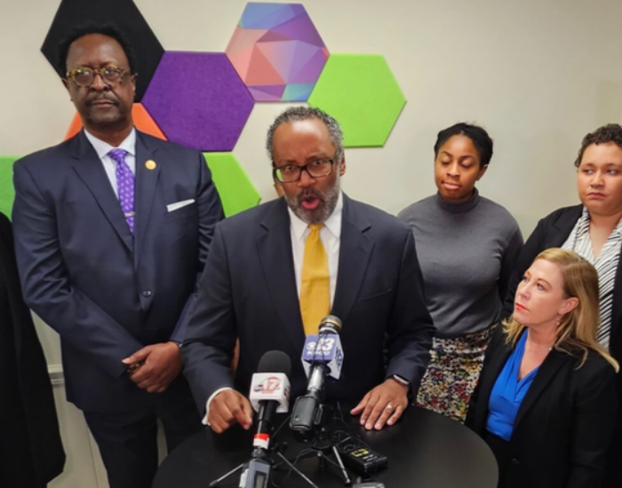 Full color picture of Rod Chapel, John Bowman, Denise Lieberman, Yolanda Martin, and McKinzie Peterson at a press conference about the voter photo identification trial in Jefferson City in November of 2023. 