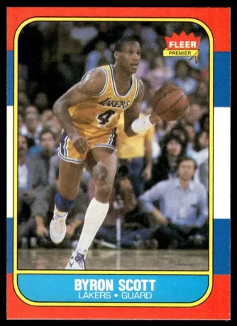A basketball player named byron scott is dribbling a basketball on a court.