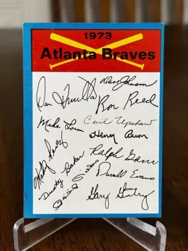 A 1973 atlanta braves baseball card with signatures on it