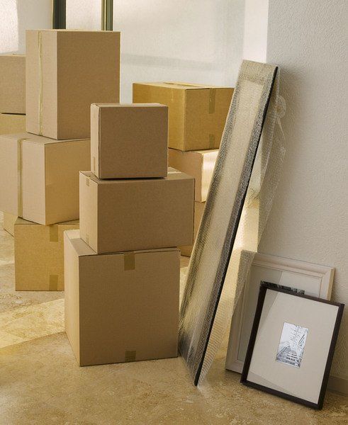 boxes are stacked in the hallway