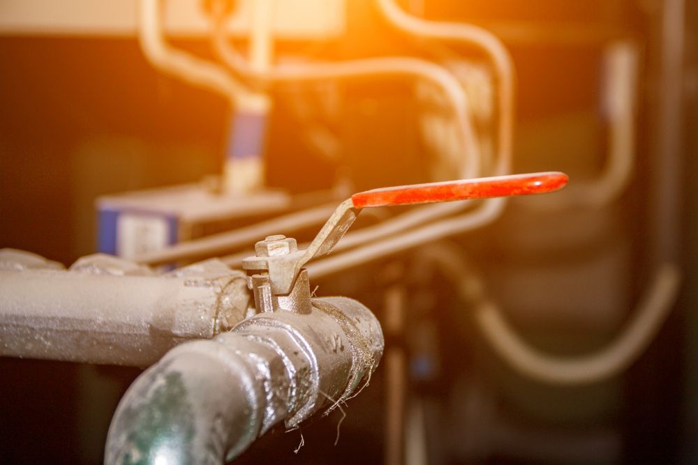 Close-up of a Red-handled Valve — One Flush Plumbing Service In Ormeau, QLD