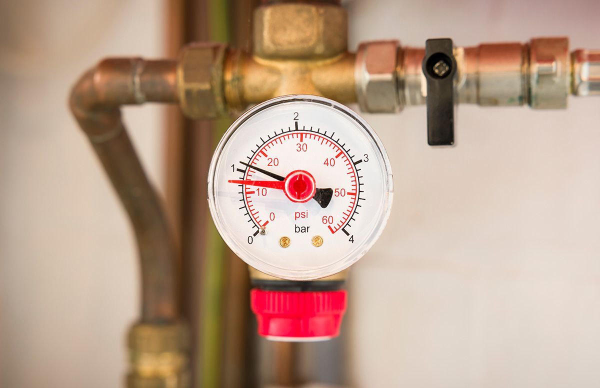 A Close up Of a Pressure Gauge on A Pipe — One Flush Plumbing Service In Oxenford, QLD
