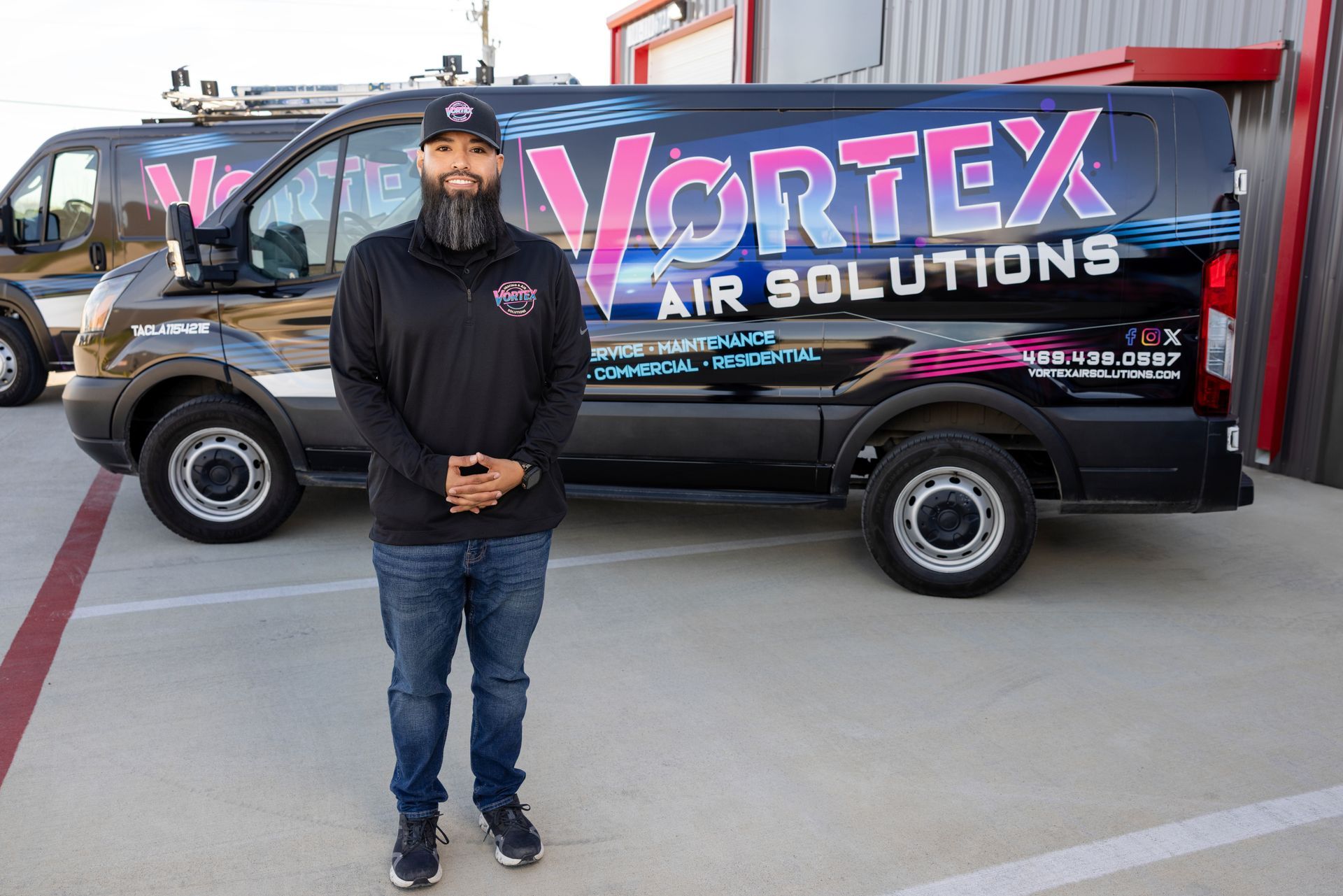 Woman and child looking out a window. They are on a windowsill with plants.