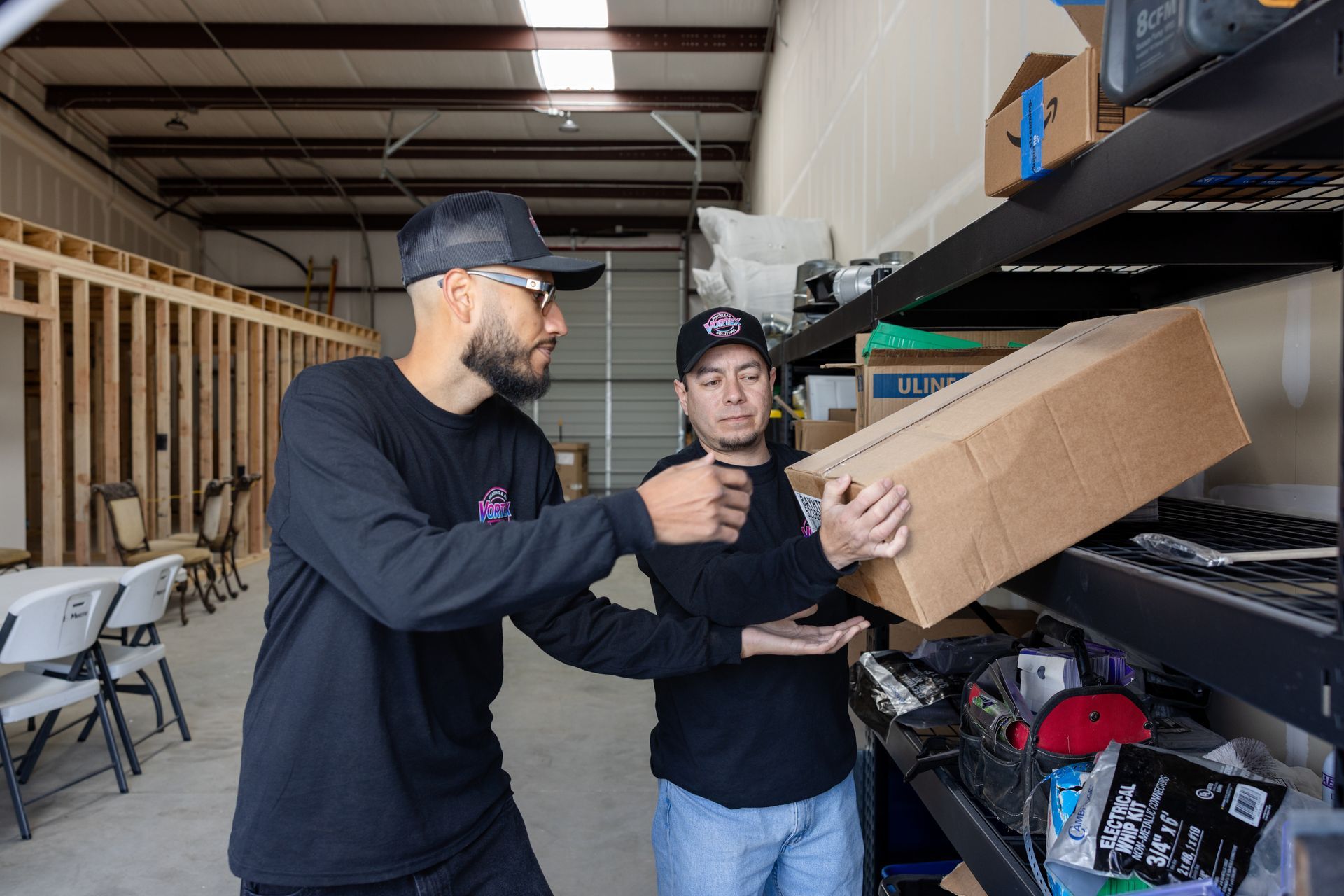 Family laughing together on a couch in a bright living room.