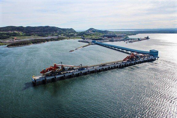 An aerial view of a dock in the middle of a body of water.