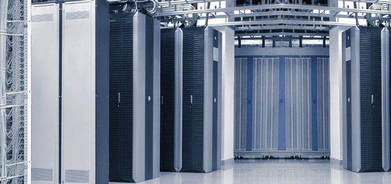 A room filled with lots of servers in a data center.