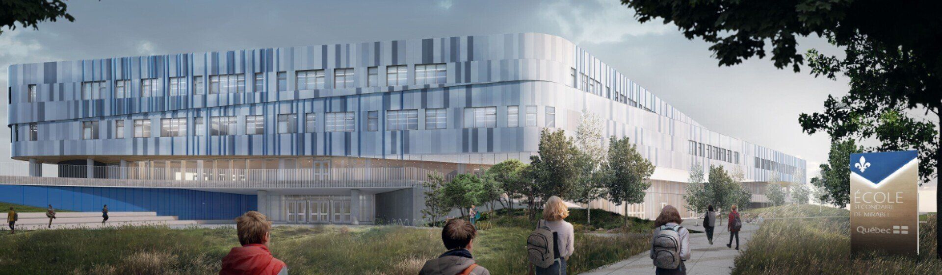 A group of people are walking down a path in front of a large building.