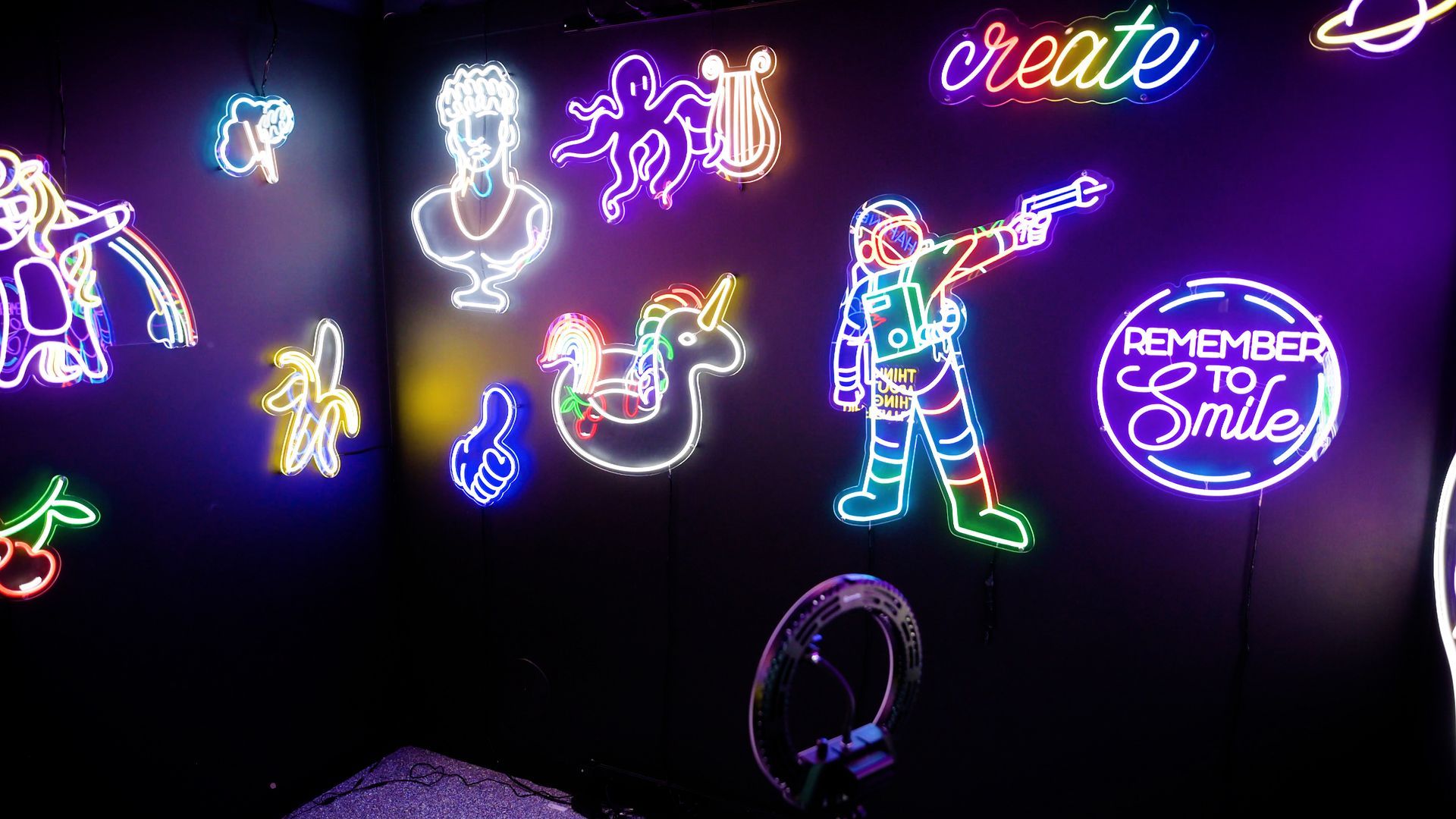 A room with a lot of neon lights on the wall.