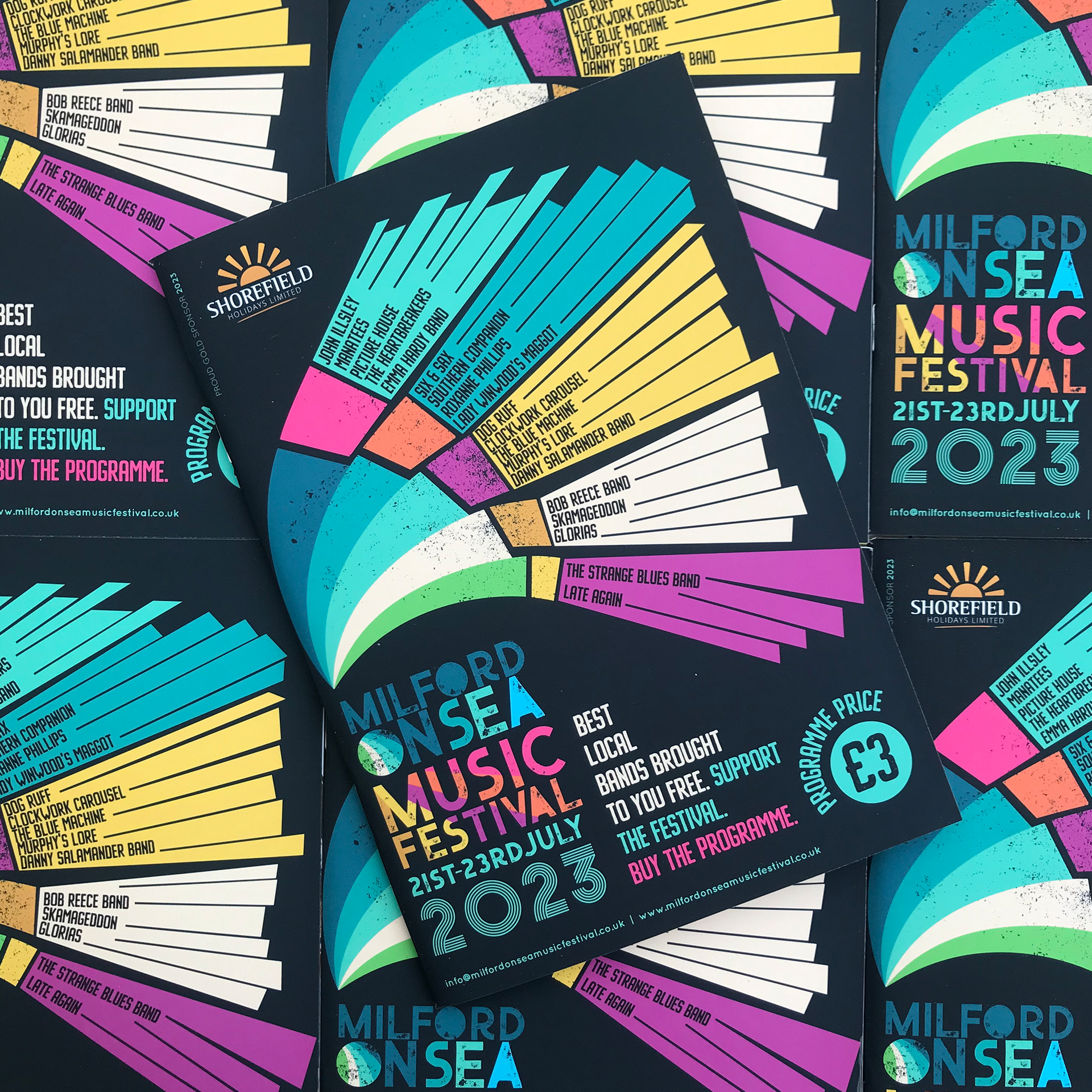 Flyers for the Milford on Sea Music Festival, with a colorful fan design on a dark background.