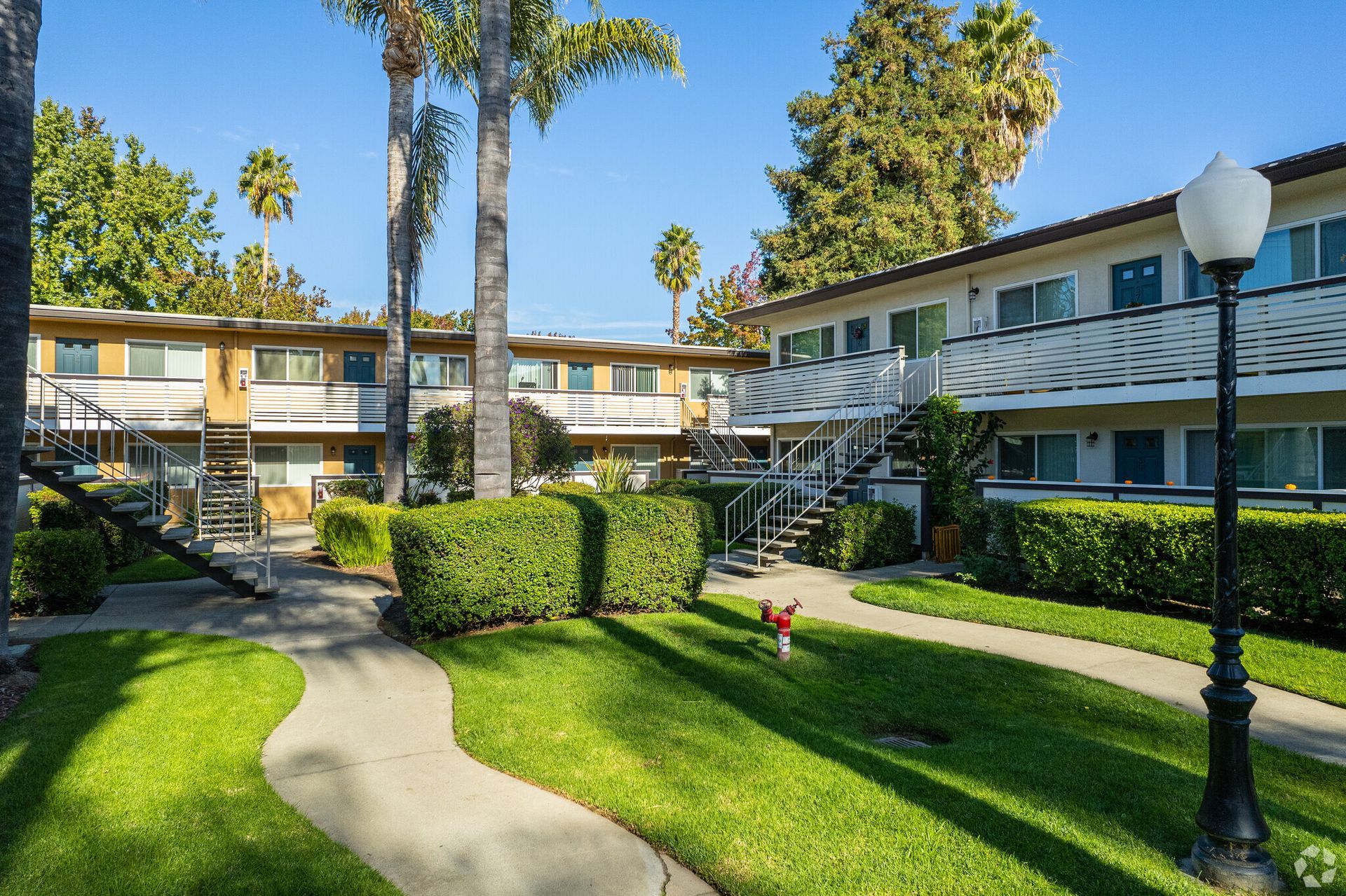 A large apartment building with a walkway leading to it