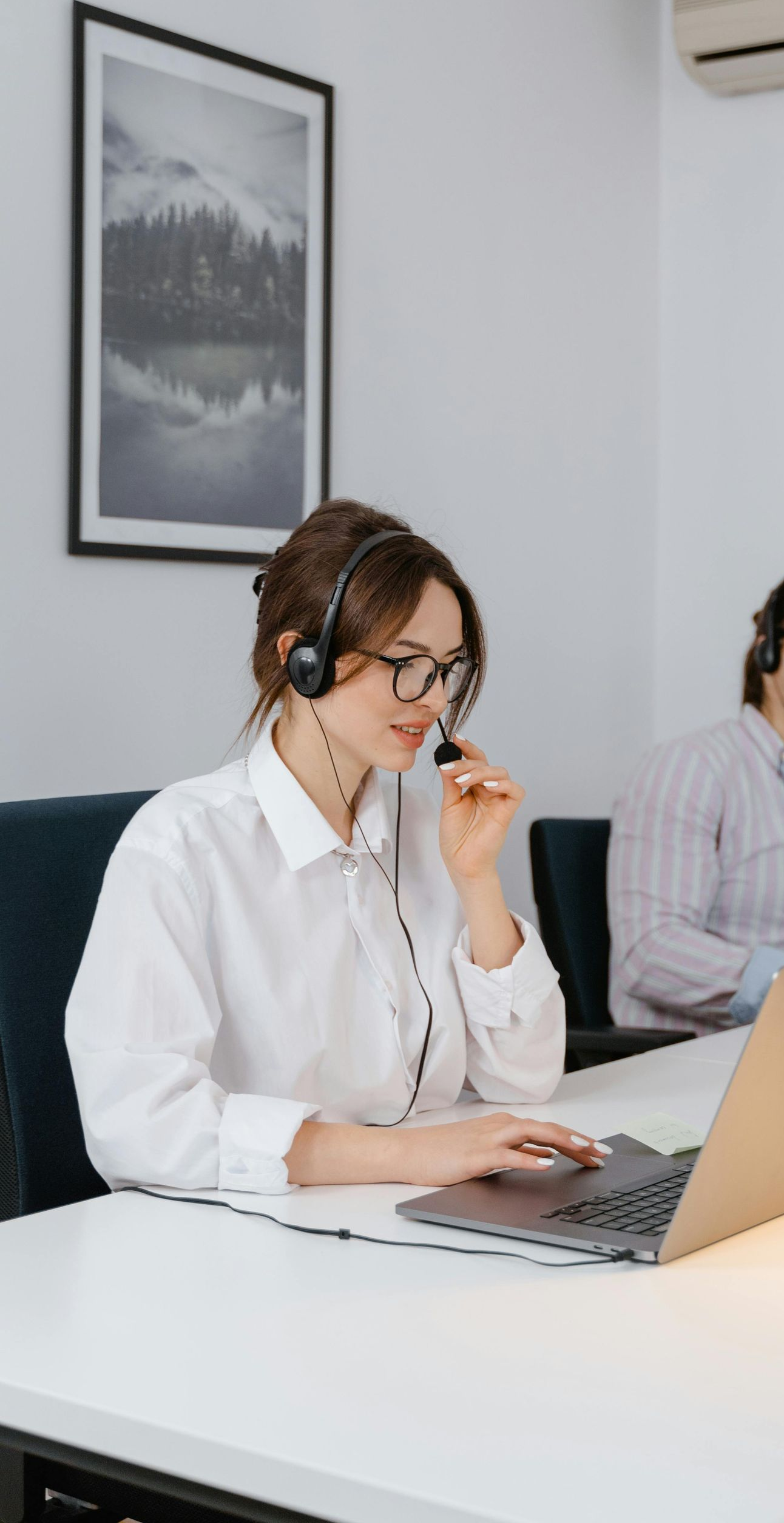 A man and a woman are standing next to each other in a park.