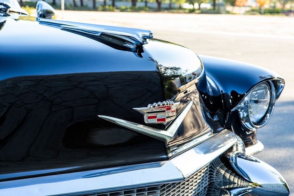 Black classic Cadillac with chrome accents.
