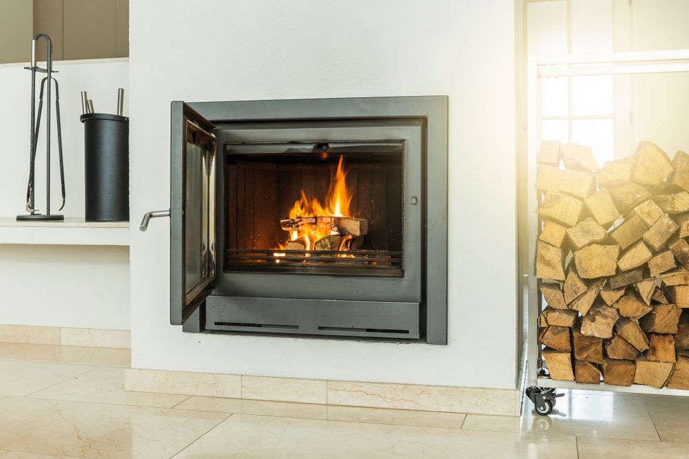 A Lit Fireplace Set Into a White Wall — Complete Heating In Launceston, TAS