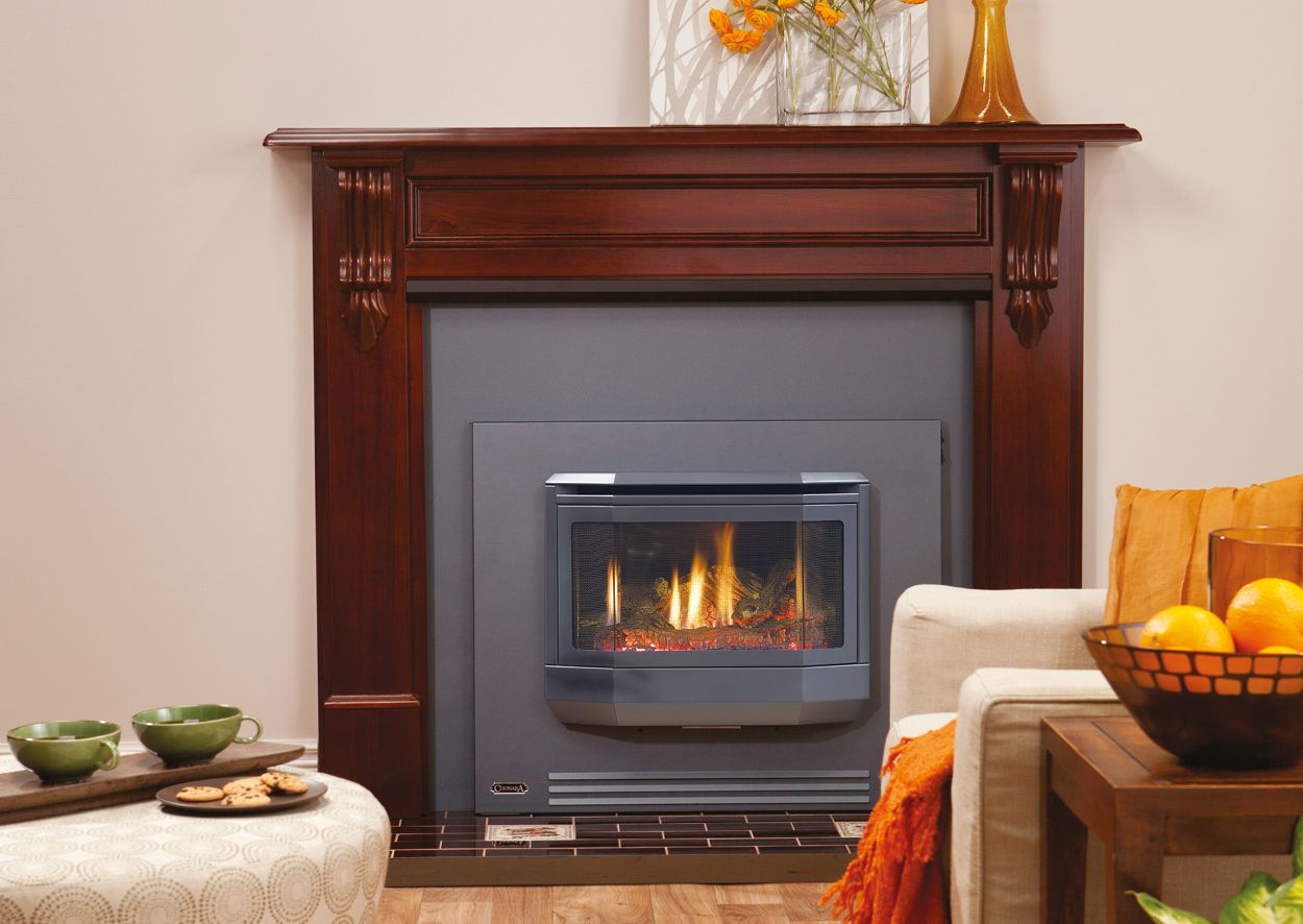 A Black Wood-burning Stove With a Chimney Pipe — Complete Heating In Huntingfield, TAS