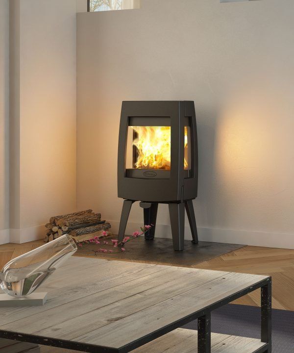 A Black Wood-burning Stove With a Chimney Pipe — Complete Heating In Huntingfield, TAS