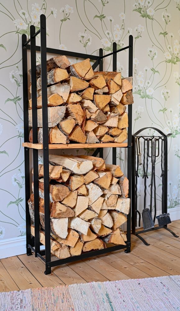 A Tall, Two-tier Black Metal Firewood Rack Filled With Split Logs — Complete Heating In Huntingfield, TAS