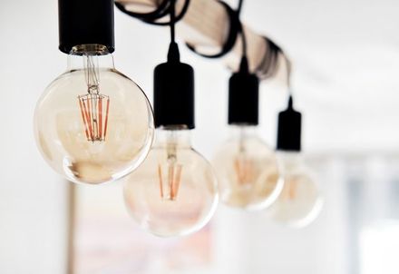 Close up on ceiling in row hanging led vintage bulb