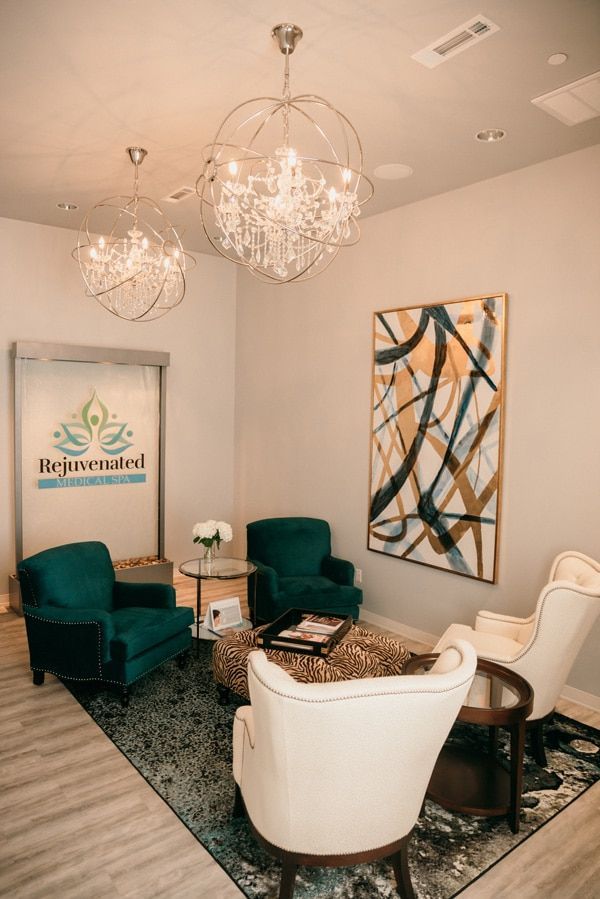 A living room filled with furniture and a chandelier.