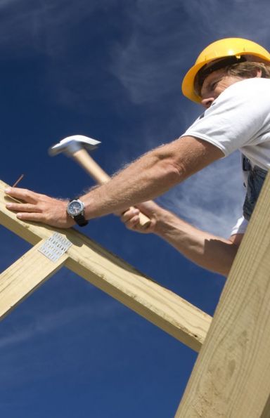 Man working on a wooden frame