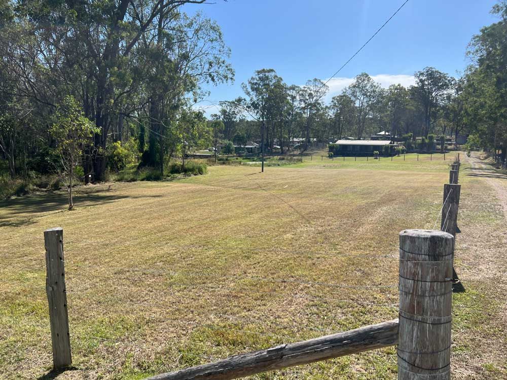 Open Field With Wooden Fence — Gardeners In Broke, NSW