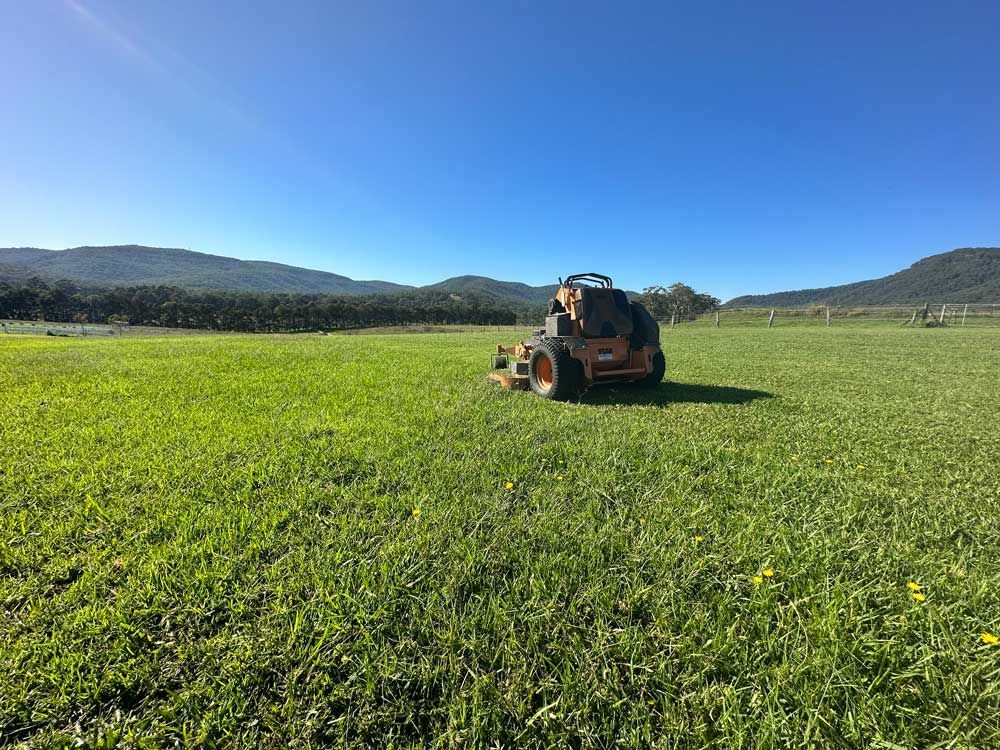 Lawn Mower On A Lush Green Lawn — Gardeners In Pokolbin, NSW
