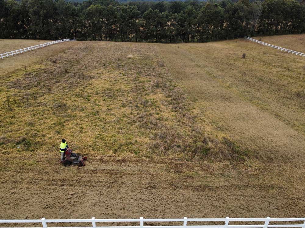 Man With Lawn Mower On Open Field — Gardeners In Branxton, NSW