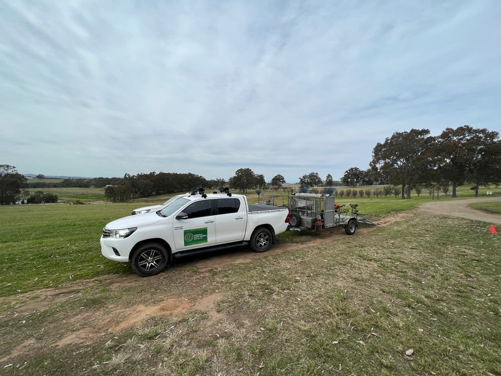 White Pick Up On Open Field — Gardeners In Pokolbin, NSW