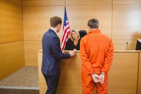 a suspect and his attorney talking to the judge