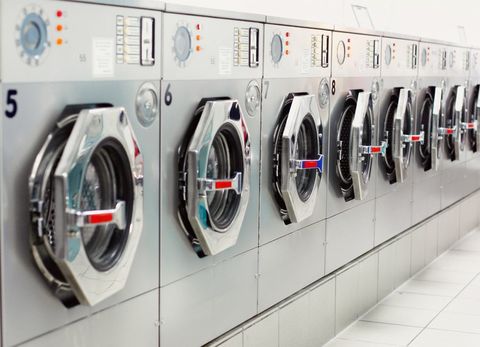 Row Of Washing Machines At Laundromat — Sarasota County, FL — Amerovent Dryer Vent Cleaning Specialists