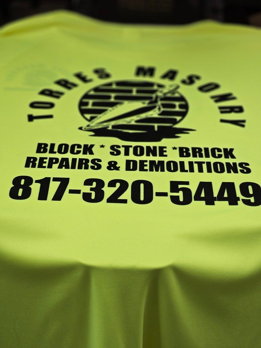 A yellow shirt that says torres masonry on it