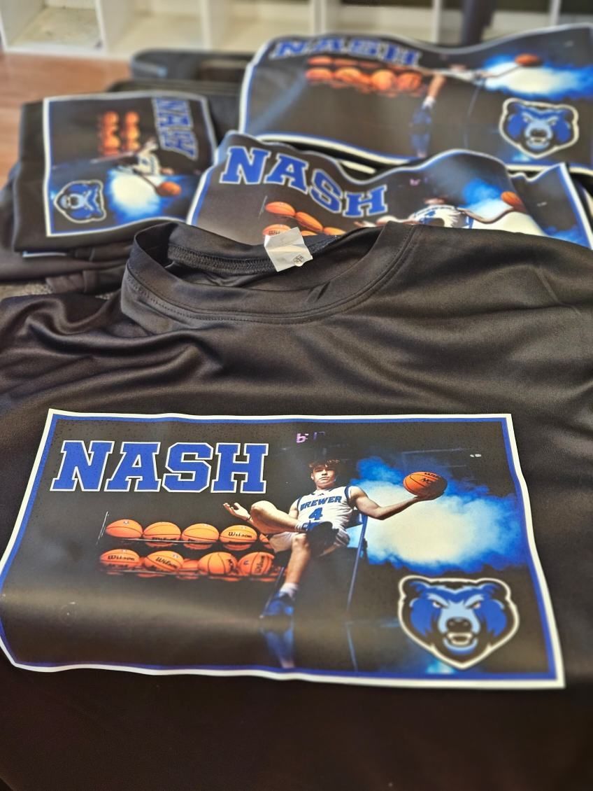 A stack of black shirts with the name nash on them