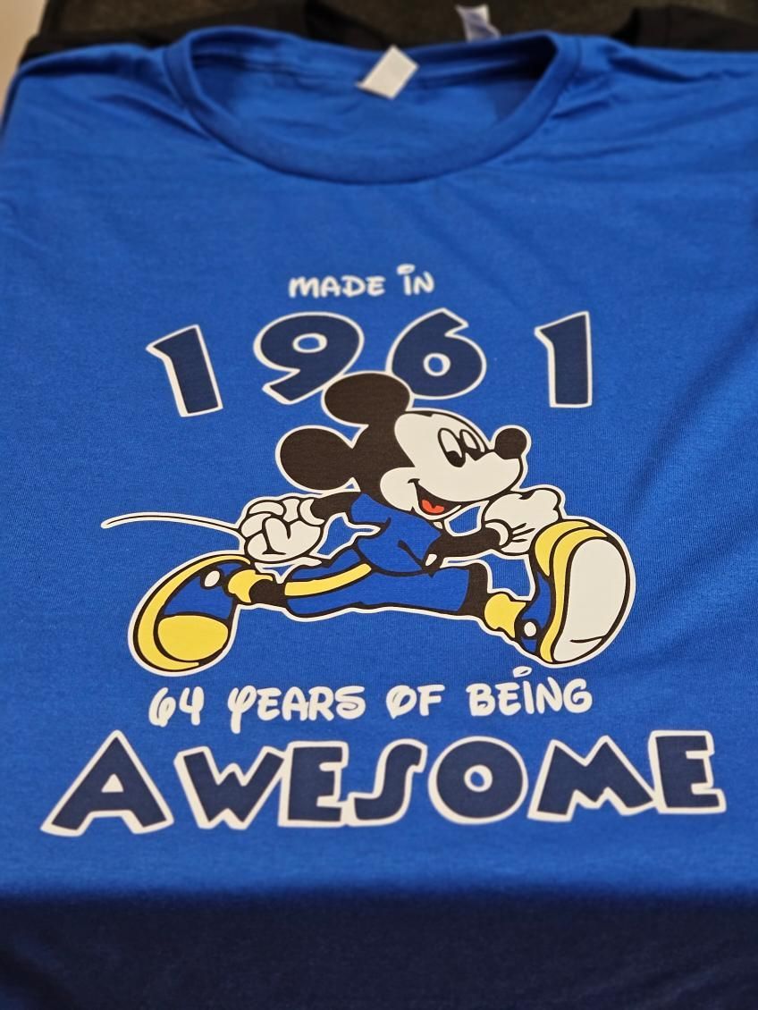 A blue shirt that says made in 1961 64 years of being awesome