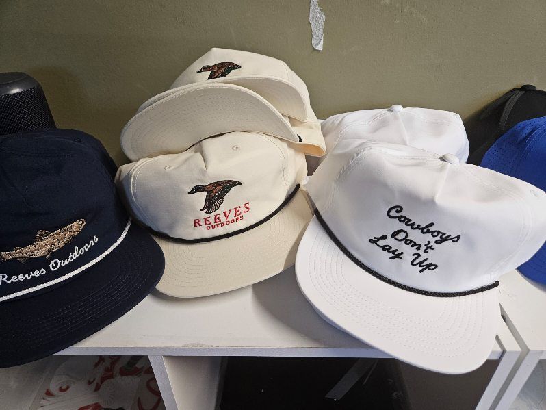 A bunch of hats including one that says cowboys don 't look up