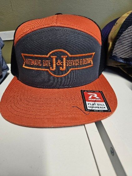 A hat with the letter j on it
