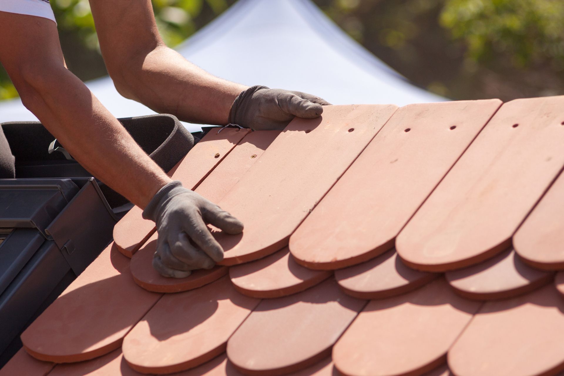 a person doing a Residential Roofing Installation