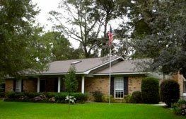House with flag | Spanish Fort, AL | Gafford Roofing Repair