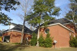 House in woods | Spanish Fort, AL | Gafford Roofing Repair