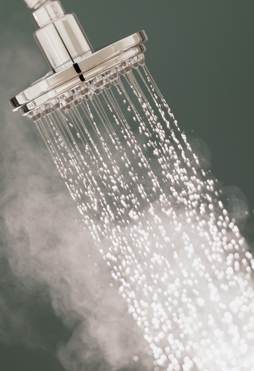 A shower head with steam coming out of it