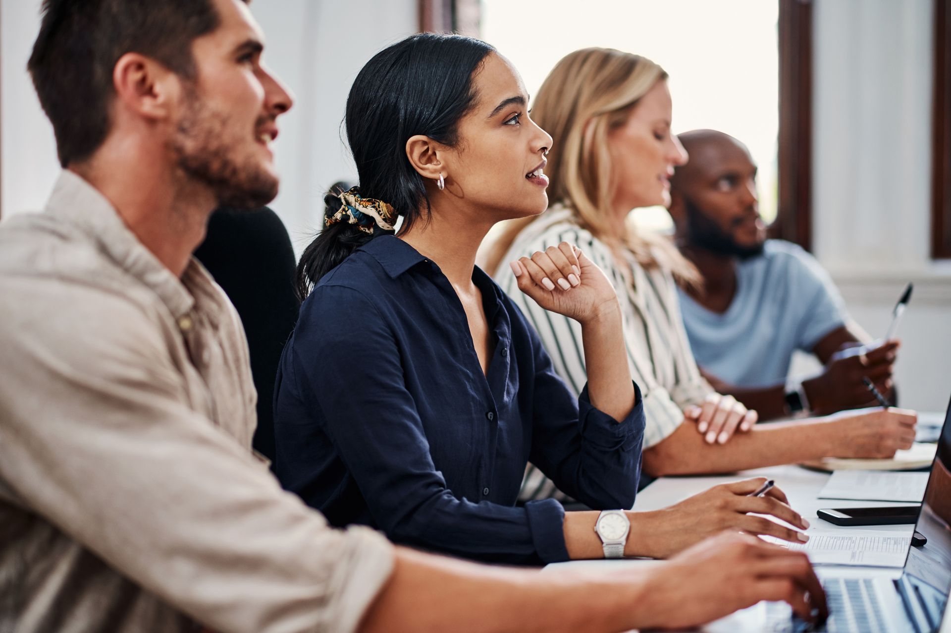 Group of diverse people attending a meeting