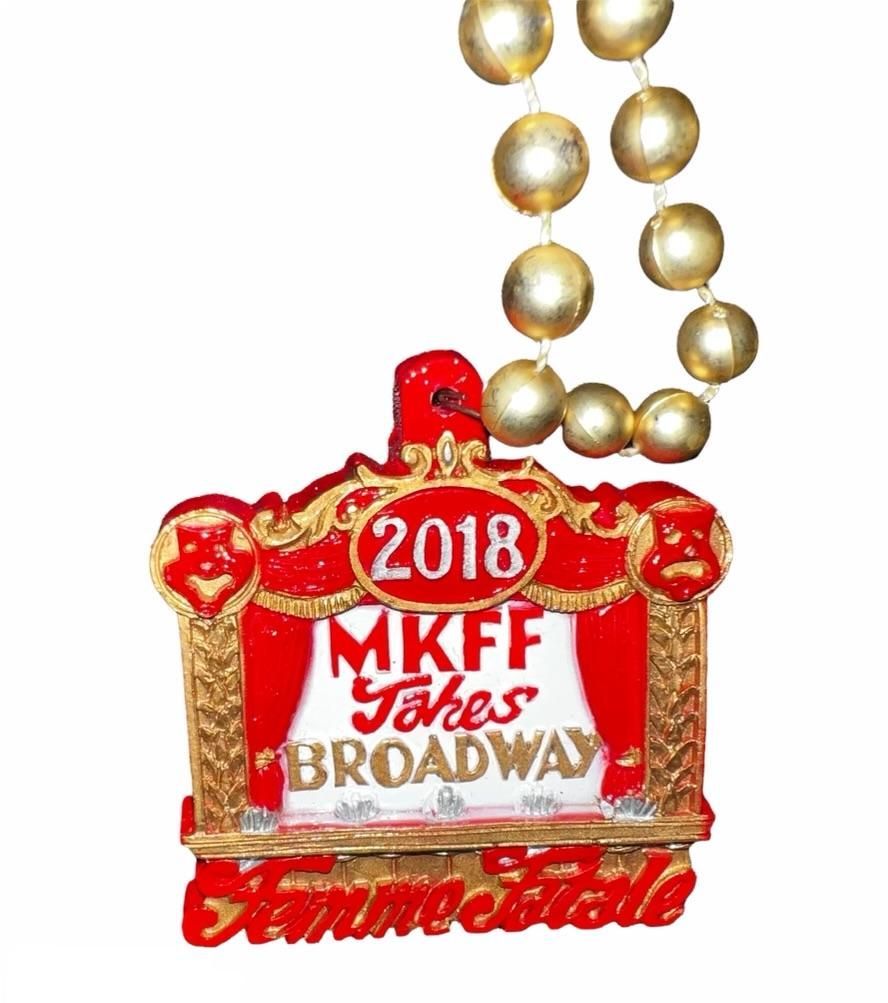 A mkff jokes broadway ornament with gold beads