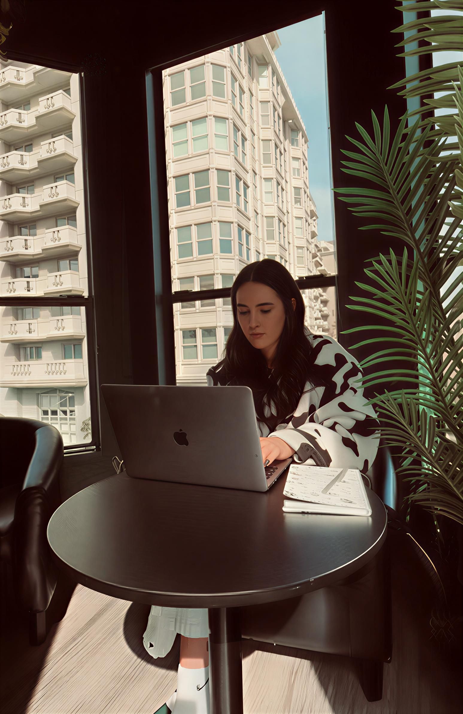 Bunk beds in a dark, minimalist hostel room with individual sleeping pods.