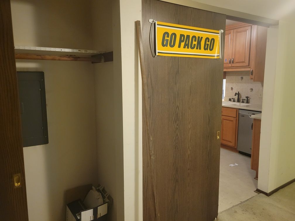 A sign on a door that says go pack go