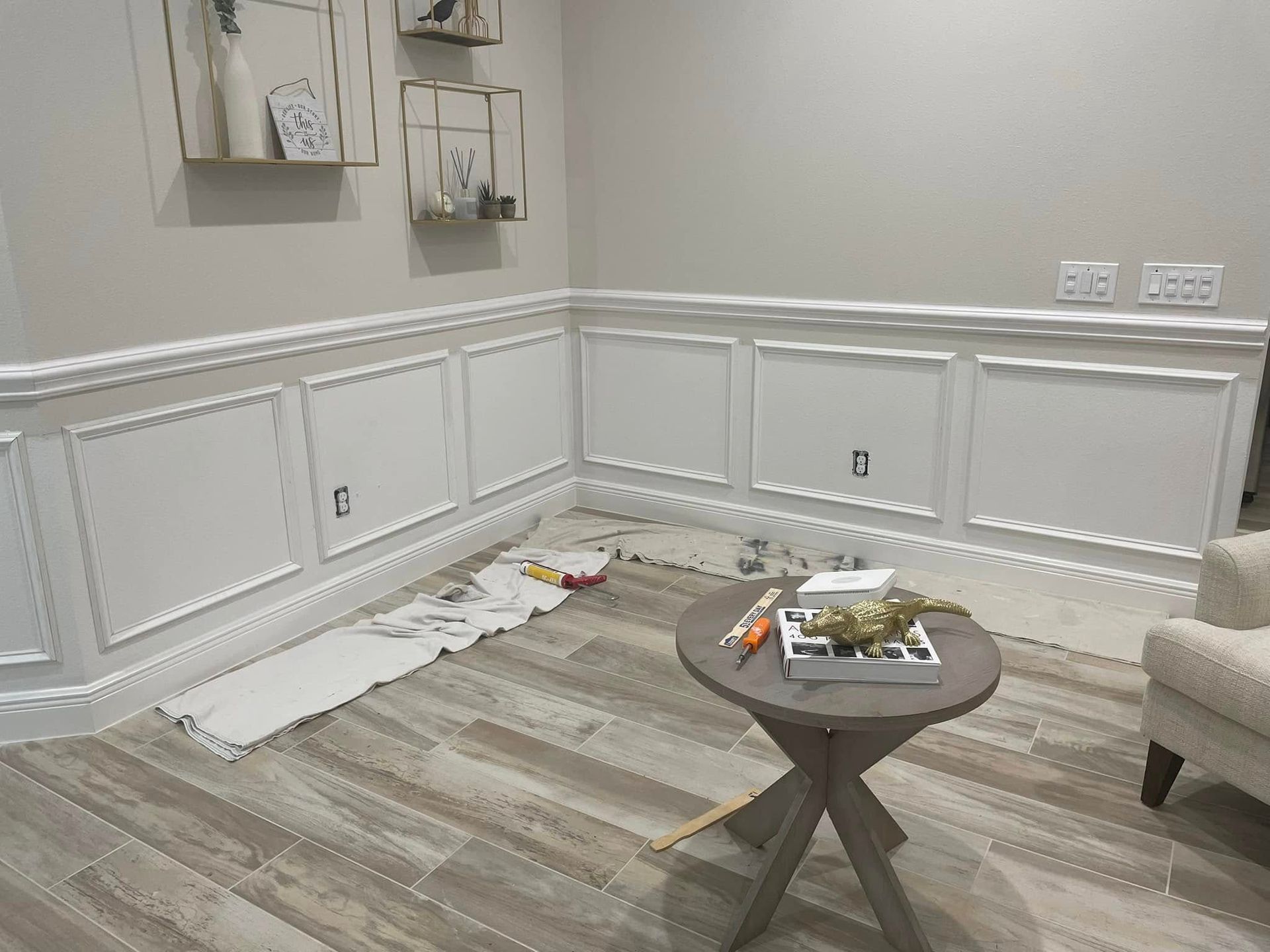 A living room with a coffee table and a chair.