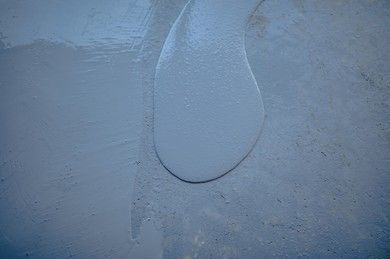 Freshly poured gray concrete surface.