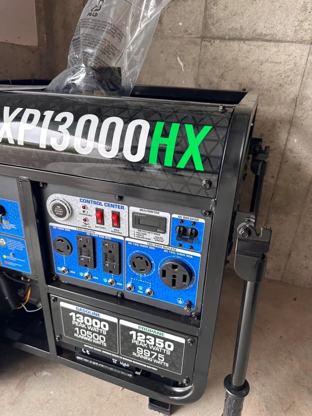 Black and blue generator with digital display and outlets, labeled 