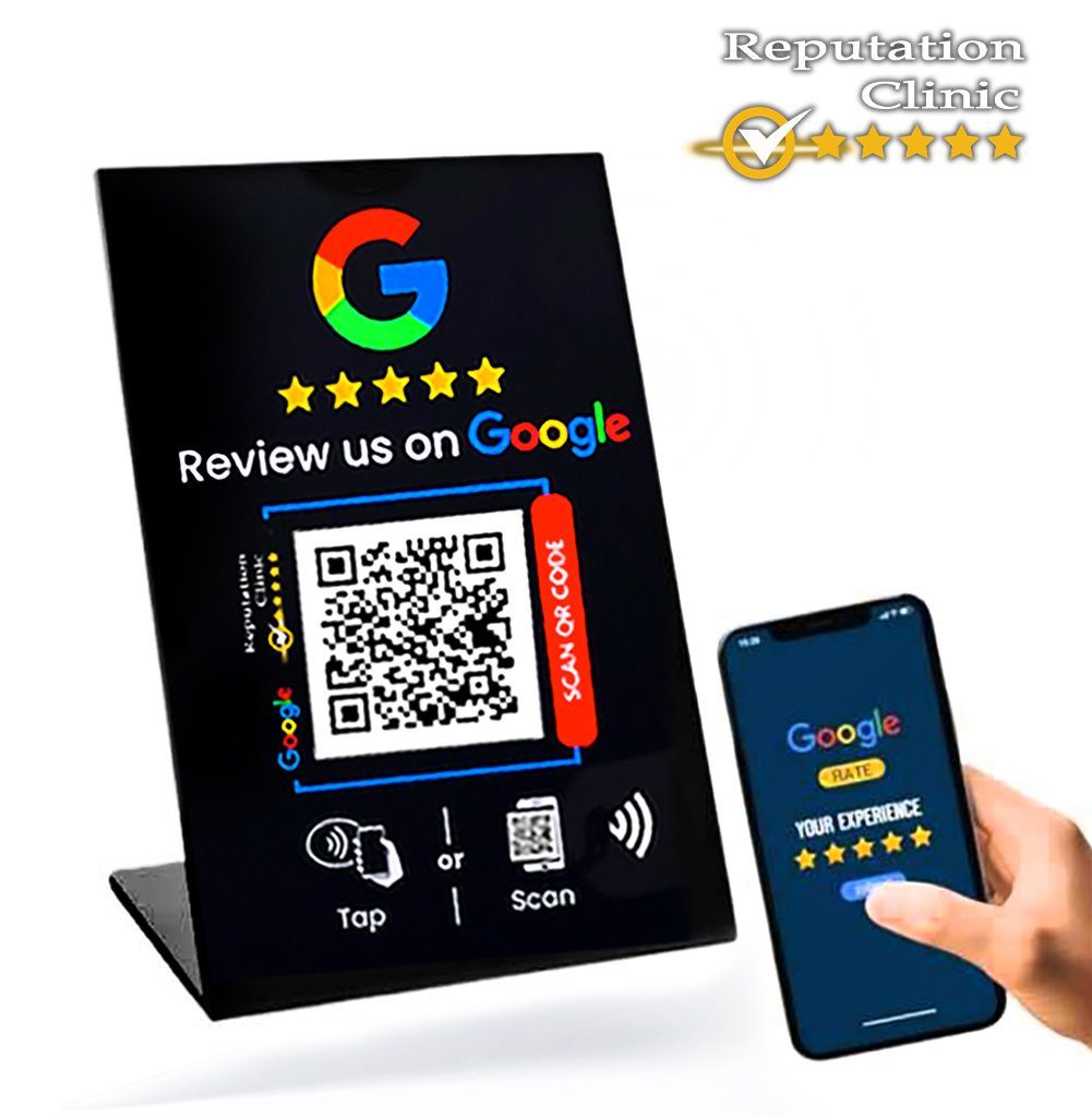 A person is holding a cell phone next to a sign that says review us on google.